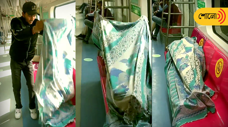 Man makes bed and sleeps inside Delhi metro train