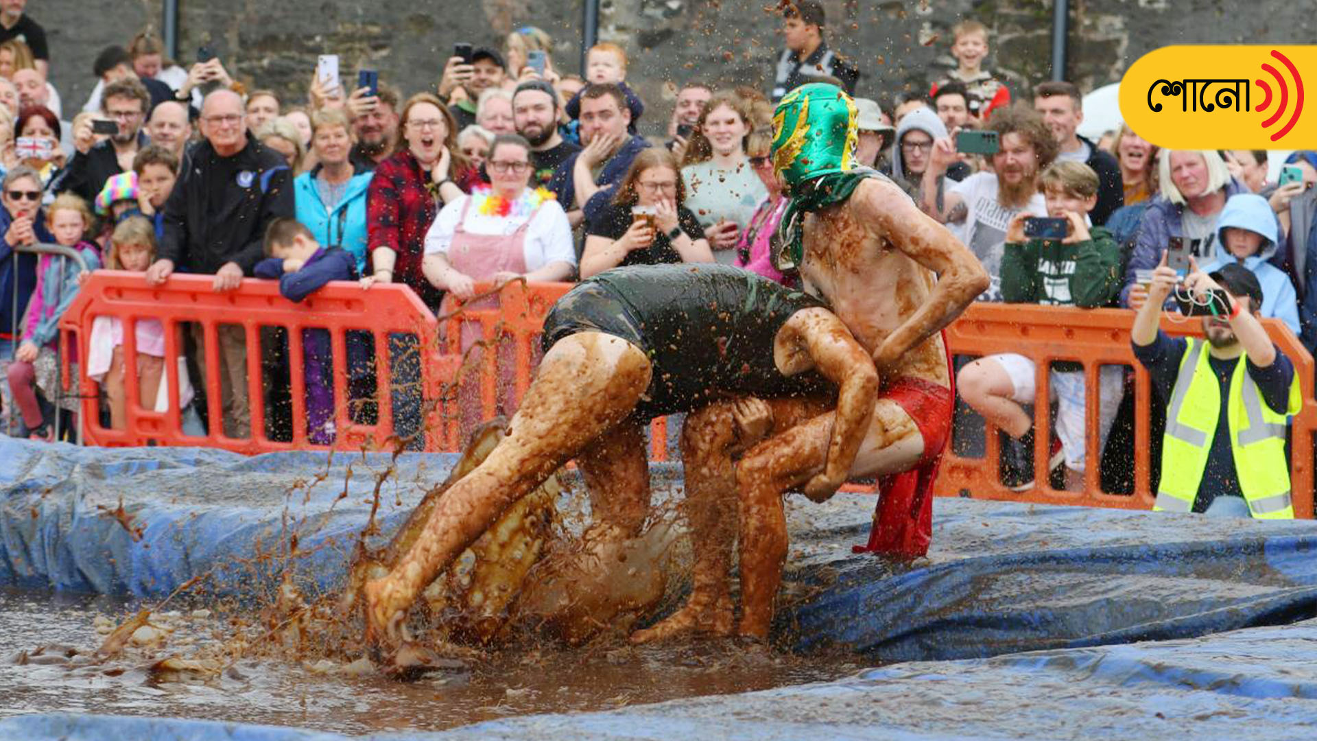 People wrestle in gravy to win the world championship title. Watch